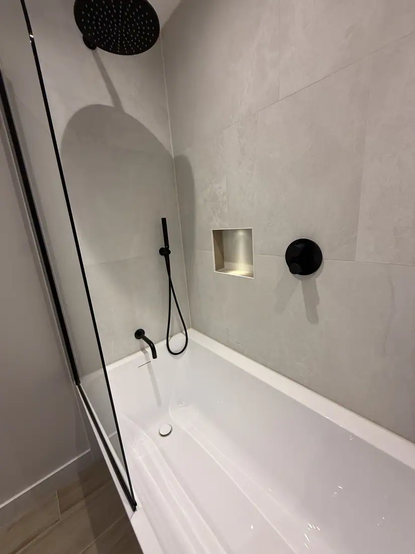 Bath with rainfall shower over