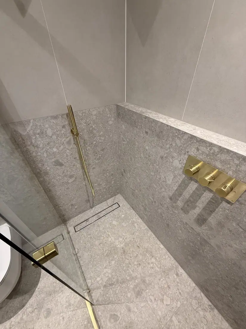 Walk-in shower, terrazzo & brass