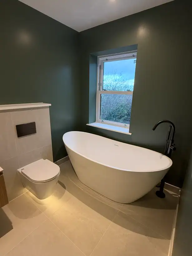 Freestanding bath, dark green bathroom